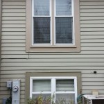 New replacement window with clay window trim on top. Old window on bottom