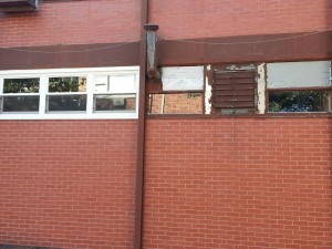 Old window on the right, replaced with new window and window trim on the left