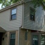 After siding, gutters, downspouts, soffit, fascia, and window trim