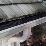 Another angle of the gutter with leaf protection and downspout