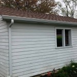 Old siding, soffit and fascia, entry door, and garage window
