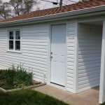 New siding, soffit and fascia, entry door, and garage window