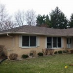 Completed roofing, gutters, and new post for front porch ceiling.