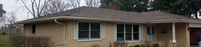 Completed roofing, gutters, and new post for front porch ceiling.