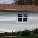 New siding, entry door, and garage window