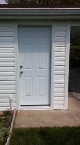 New entry door, siding, and soffit and fascia